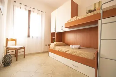 Letto o letti in una camera di Beach Apartment, comodo tra il centro e il mare
