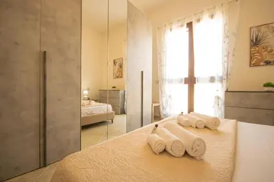 Letto o letti in una camera di Beach Apartment, comodo tra il centro e il mare