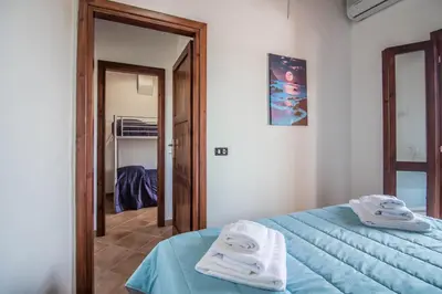 Letto o letti in una camera di GuestHost - Oasis with Garden, Pool and WiFi