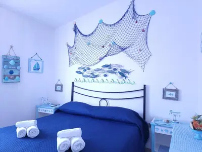 Letto o letti in una camera di Residenze Lu Rinaggiu