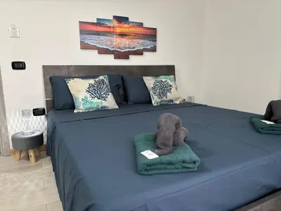 Letto o letti in una camera di 5 Zimmer Rooms ''Rosa''