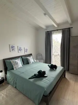 Letto o letti in una camera di 5 Zimmer Rooms ''Rosa''