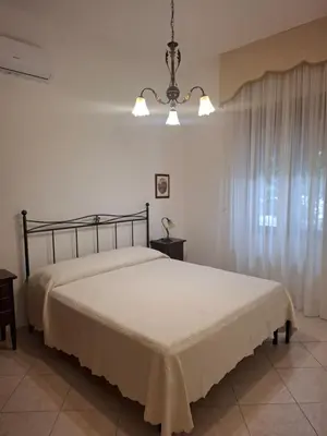 Letto o letti in una camera di Casa Anna
