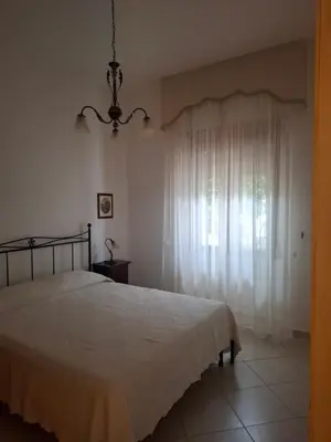 Letto o letti in una camera di Casa Anna