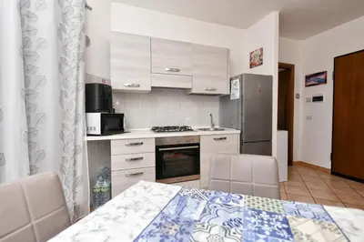 Cucina o angolo cottura di Perla Apartment con vista mare