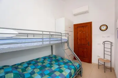 Letto o letti in una camera di Rosa