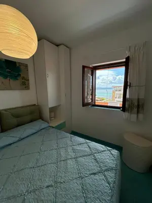 Letto o letti in una camera di Casa Arianna