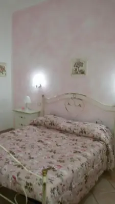 Letto o letti in una camera di B&B Le Rose