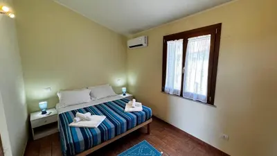 Letto o letti in una camera di Tavolara View in Santa Lucia