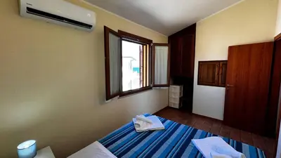 Letto o letti in una camera di Tavolara View in Santa Lucia