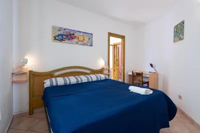 Letto o letti in una camera di La Brezza