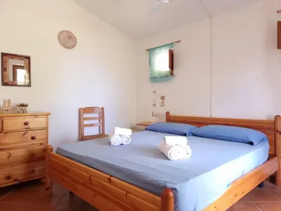 Letto o letti in una camera di Residenza Bella Vista - Budoni Sweet Home