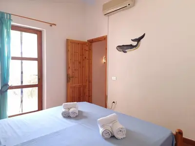 Letto o letti in una camera di Residenza Bella Vista - Budoni Sweet Home
