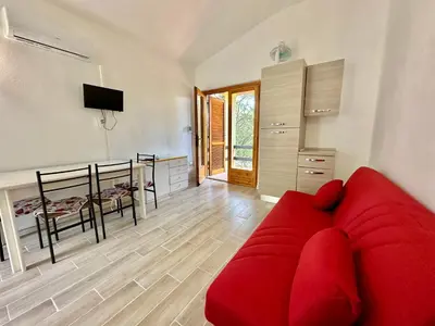 TV o dispositivi per l'intrattenimento presso Appartamento a 650 mt dal mare - San Teodoro