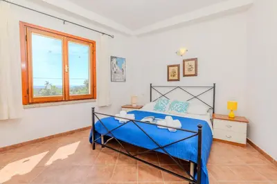 Letto o letti in una camera di Panoramic Terrace Over Tavolara - Relax and Sea View