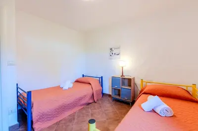 Letto o letti in una camera di Green Oasis - 2 Min Walk from Cala Girgolu
