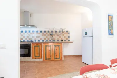 Cucina o angolo cottura di Green Oasis - 2 Min Walk from Cala Girgolu