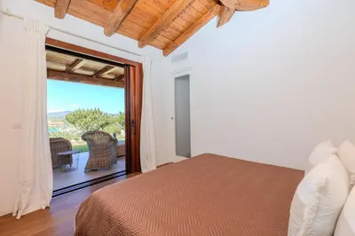 Letto o letti in una camera di Villa Capo Coda Cavallo Baia Salinedda