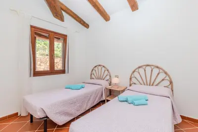 Letto o letti in una camera di Villa Due Mari Coda Cavallo