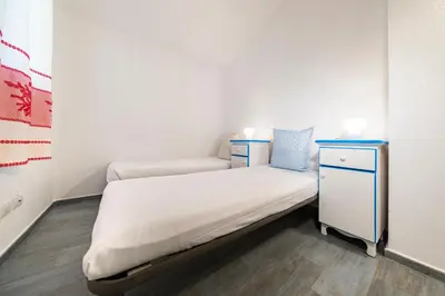 Letto o letti in una camera di NG Collection Luna di Mare