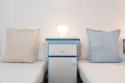 Letto o letti in una camera di NG Collection Luna di Mare