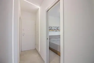 Letto o letti in una camera di GuestHost - Elegant Beachfront Wi-Fi & Parking