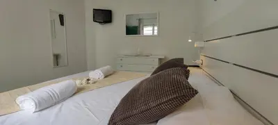 Letto o letti in una camera di SUNRISE SARDINIA San Teodoro