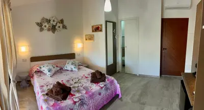 Letto o letti in una camera di Villaggio La Cinta