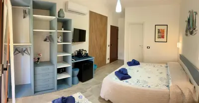 Letto o letti in una camera di Villaggio La Cinta