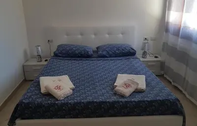 Letto o letti in una camera di SUNRISE SARDINIA Olbia