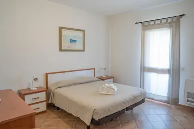 Letto o letti in una camera di Giodi Appartamenti La Cinta 3