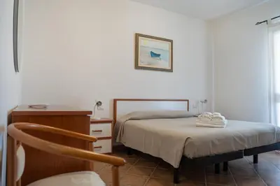 Letto o letti in una camera di Giodi Appartamenti La Cinta 3