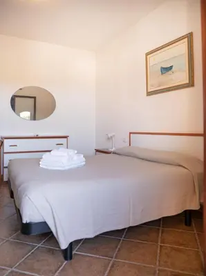 Letto o letti in una camera di Giodi Appartamenti La Cinta 3