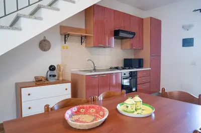 Cucina o angolo cottura di Giodi Appartamenti La Cinta 3