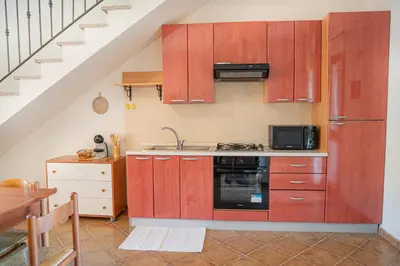 Cucina o angolo cottura di Giodi Appartamenti La Cinta 3
