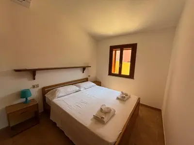 Letto o letti in una camera di La Domus di Jacqueline