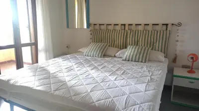 Letto o letti in una camera di Casa Maggy