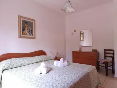 Letto o letti in una camera di Le Residenze Su Puntu - Budoni Sweet Home