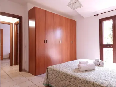 Letto o letti in una camera di Le Residenze Su Puntu - Budoni Sweet Home