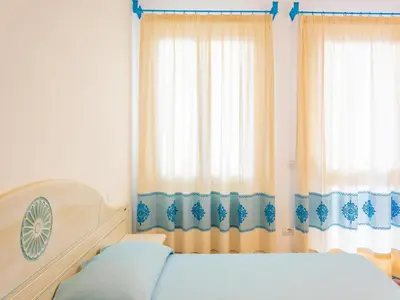 Letto o letti in una camera di Apartment in Orosei near Marina di Orosei Beach