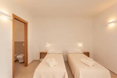 Letto o letti in una camera di Lu Sulianu