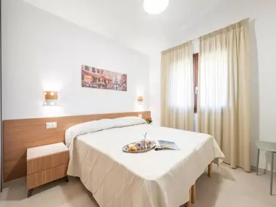 Letto o letti in una camera di San Teodoro Holiday Stay for 6