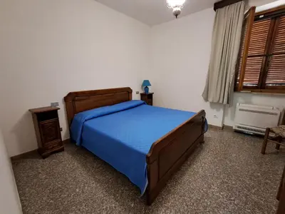 Letto o letti in una camera di fmp-ps01 villa 300 metri mare 4 letto