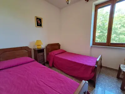 Letto o letti in una camera di fmp-ps01 villa 300 metri mare 4 letto