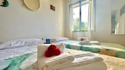 Letto o letti in una camera di Tina's Tiny House - 10 meters from the beach