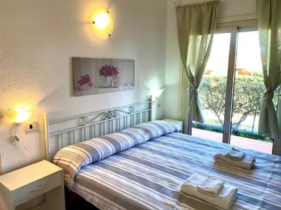 Letto o letti in una camera di Vermentino - Apartment - 200m from the Beach - Garden - Wi-Fi - AC - BBQ - Parking - Pet Friendly