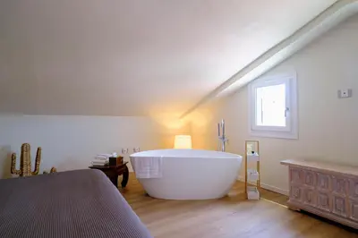 Letto o letti in una camera di Roof33 Attico di Lusso in centro a Olbia