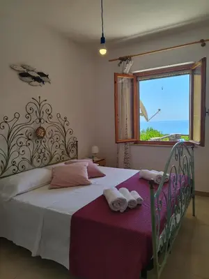 Letto o letti in una camera di Icore a mare IUN T7289