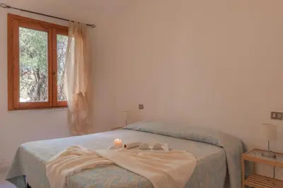 Letto o letti in una camera di Outstanding Residenze Gallura 2Bedrm sleep 6 plus possible additional Child bed