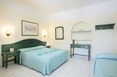 Letto o letti in una camera di Alba Dorata Resort